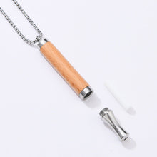 Resistance Necklace parts — wooden pendant, steel mouthpiece and cotton core