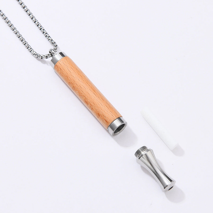 Resistance Necklace parts — wooden pendant, steel mouthpiece and cotton core